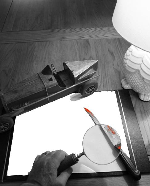 Image showing a desk blotter, a knife tipped with blood, and a magnifying glass