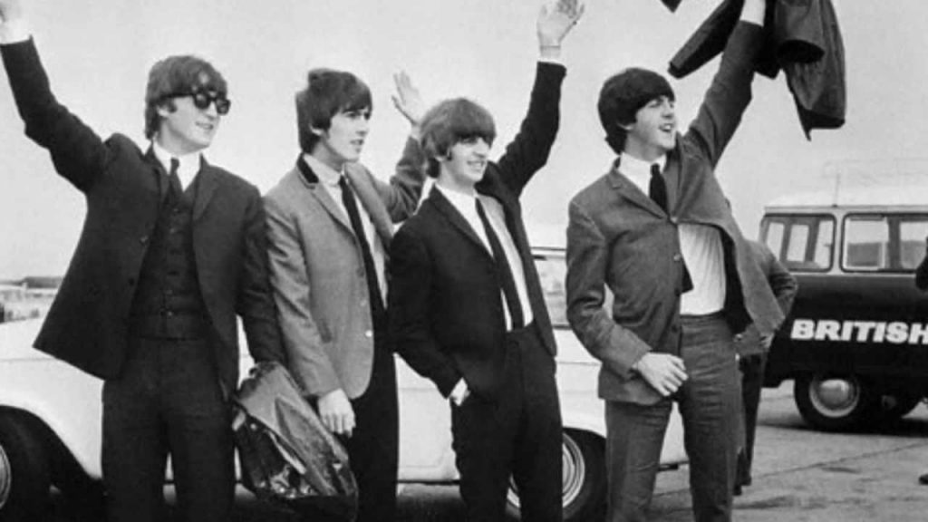 Photograph of the Beatles at an airport